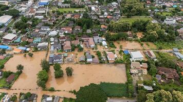 Suburb area in Chiang Rai province flooding by Kok river after typhoon Yagi has swept Southeast Asia. photo
