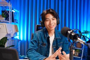 Smiling man sharing thoughts during broadcast photo