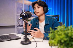 Podcaster using hand gestures during session photo