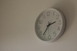 Clock in the wall in the twilight photo