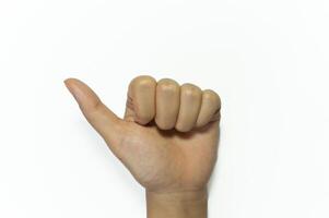 Hand showing thumbs up sign against isolated on white background photo