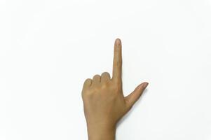 Woman pointing at something on white background, closeup of hand. photo