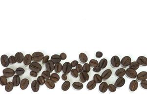 Roasted coffee beans isolated on white background photo