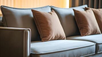 Grey sofa with pillows in mocha mousse shade. Trendy color of 2025 year in interior design photo