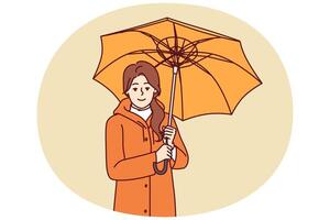 Woman with umbrella is dressed in oilcloth coat so as not to get wet from rain on autumn vector