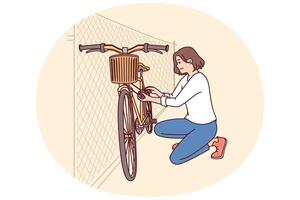 Woman parks bicycle near fence after returning from work on environmentally friendly vector