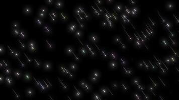 Abstract animation of colorful falling star trails or meteors on a black background, a dynamic visual effect suitable for overlays and motion graphics. video