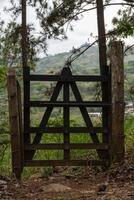 Rustic Wooden Gate Overlooking Mountain Landscape photo