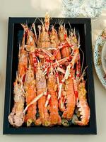 Fresh crayfish roasted using the rustic method serving photo