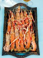 Fresh crayfish roasted using the rustic luxury method photo