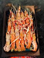 Fresh crayfish roasted using the rustic method hot photo