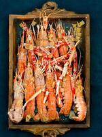 Fresh crayfish roasted using the rustic method vintage photo