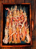 Fresh crayfish roasted using the rustic method traditional photo