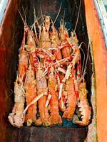 Fresh crayfish roasted using the rustic method rustic wood photo