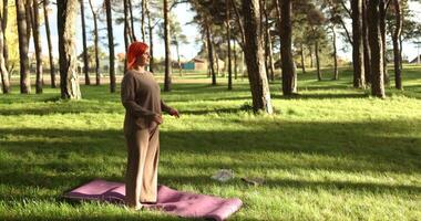 Engage in an Outdoor Yoga Practice amidst the serene and soothing elements of nature video