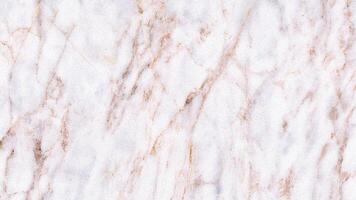 Light pink and white marble surface with soft grain and veining photo