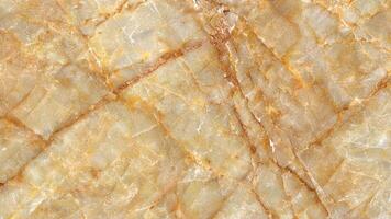 Honey-toned marble surface with crosshatched veining close-up stone pattern photo