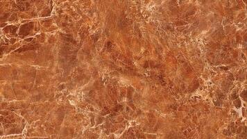 Warm brown marble with soft cream veins and high polish surface photo
