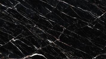 Black marble with bold white streaks and polished finish photo