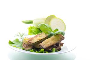 Zucchini with a crispy crust and fresh salad photo