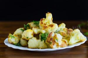Top view of crispy cauliflower with parsley photo