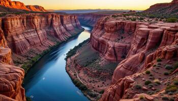 a river winding through a canyon of red rock cliffs photo