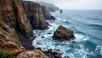 craggy seaside cliffs pounded by waves, with sea mist rising into the air and seaglass colored water crashing against the rocks. photo