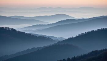foggy hills layered in fading shades of grey and blue. photo