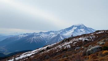 windswept ridge under overcast mountain sky. photo