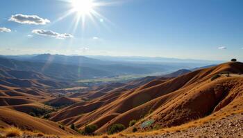 dry hills rolling endlessly beneath sunlit sky. photo