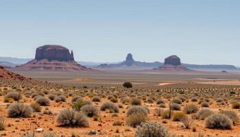 a wide desert plain with scattered rock formations and dry shrubs. photo