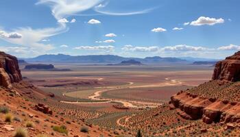 a high desert plateau with red mesas and dry riverbeds. photo