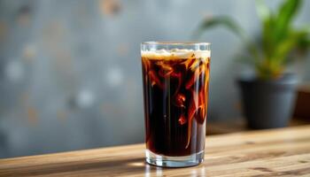 a cold brew coffee served in a tall, transparent glass. photo