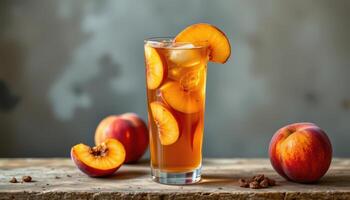 a glass of peach iced tea with visible peach slices. photo
