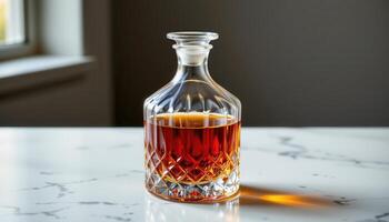 a crystal decanter filled with amber bourbon. photo