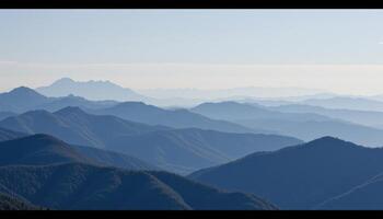 a series of mountain peaks fading into the distance. photo
