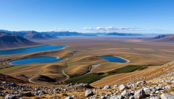 a tundra landscape dotted with small lakes. photo