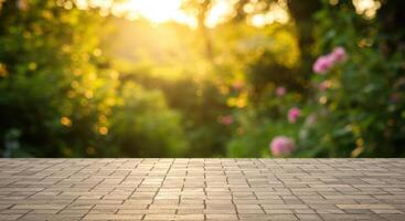 Empty stone patio with blurred green garden background and warm sunlit bokeh effect. photo