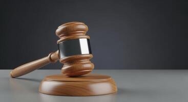 Wooden Judge Gavel with Silver Band on a Table, Symbolizing Law and Justice photo