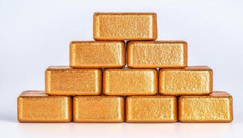 Golden bars stacked in a pyramid formation, symbolizing wealth, finance, and investment. photo
