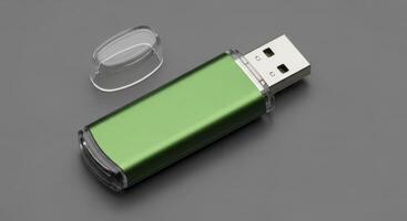 A metallic green USB flash drive with its clear cap removed on a grey surface photo