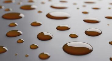 Glossy caramel colored liquid droplets scattered on a smooth light gray surface photo