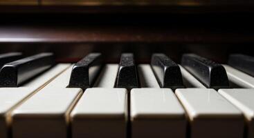 Close up low angle view of vintage black and white piano keys with dramatic lighting photo
