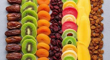 Colorful Dried Fruits Arranged in Vertical Rows for a Healthy Snack Assortment photo