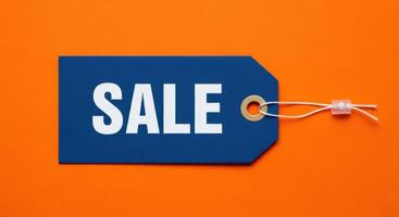 Blue Sale Price Tag with White Text on an Orange Background for Retail Promotions photo