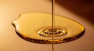 Golden liquid pouring and pooling on a reflective surface with rich texture and ripples photo