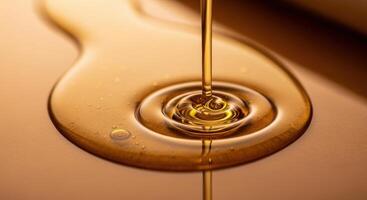 Golden viscous liquid pouring and spreading, highlighting its rich texture and natural flow photo