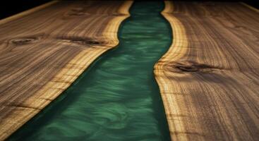 Emerald green resin river flowing through a live edge walnut wooden tabletop photo