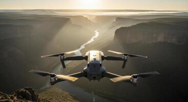 Modern drone capturing an aerial view of a vast canyon and winding river at sunrise photo