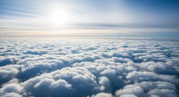 Aerial View of Fluffy White Clouds Stretching to the Horizon Under a Bright Sunny Sky photo